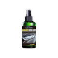 150ml bottle of car headlight repair liquid with applicator brush on a yellowed car lamp.