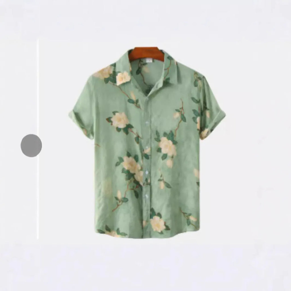 Man's short sleeve Hawaiian print shirt with lapel collar and floral pattern, shown in a casual setting.