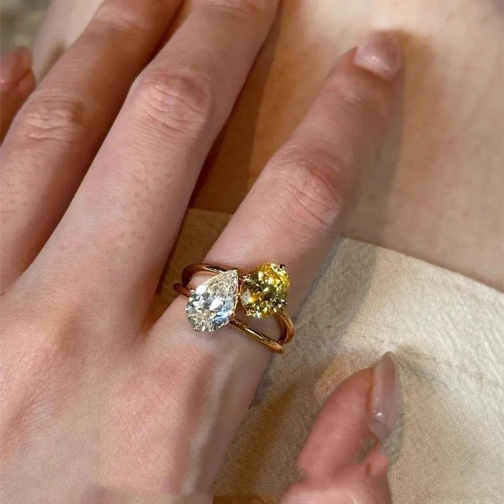 Copper open geometric ring for women with water drop contrast colour double sheng stone setting.