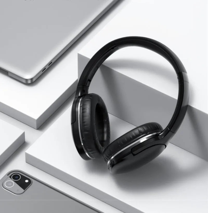 Black and white wireless Bluetooth sports headset with head-mounted design showing ear cups and headband
