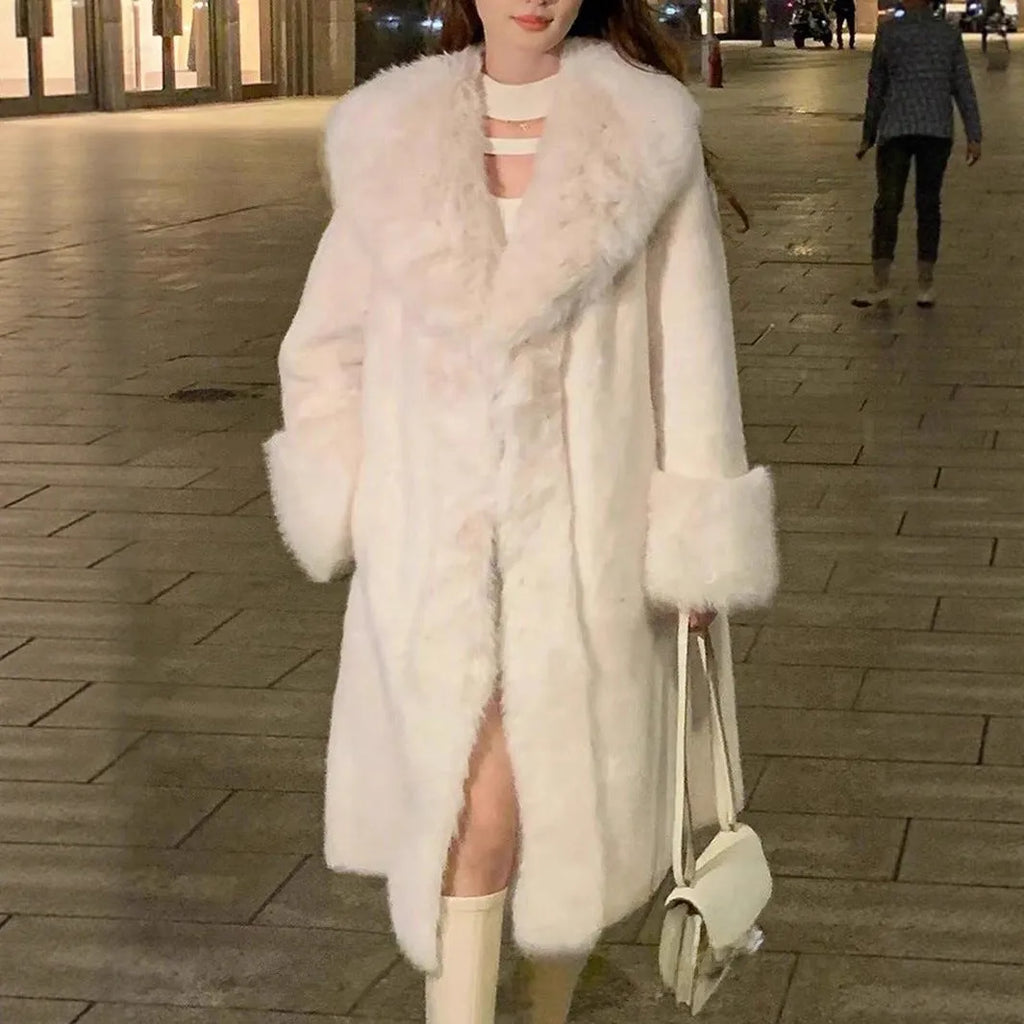A grey women's thick faux rabbit fur coat with a fur collar, shown mid-length.