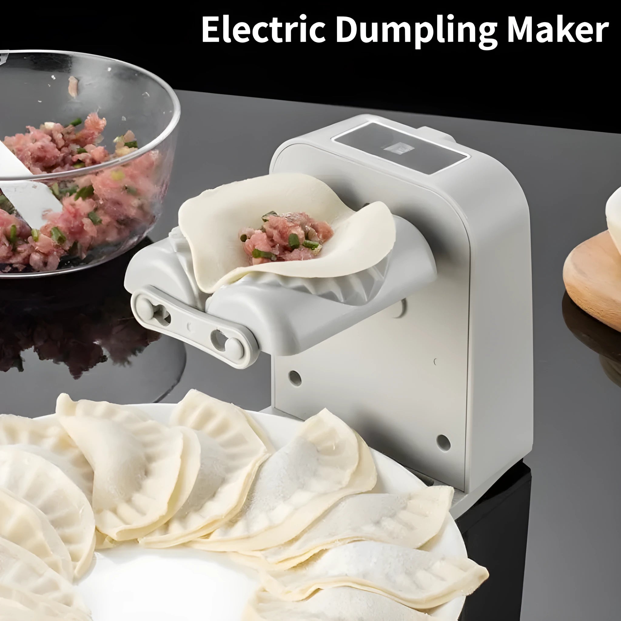 White electric dumpling maker machine with USB charging cable and accessories on kitchen counter