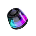 Portable white Bluetooth speaker with ambient lighting and magnetic base for desktop use