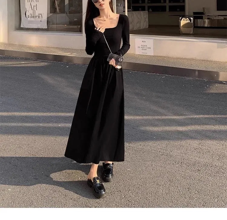 Black square collar knitted A-line dress with long sleeves and an elastic waist on a model.