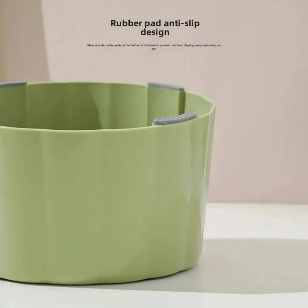 Green high-stand cat bowl with cactus design and a large opening.