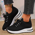 Women's black mesh lace-up sneakers with flat rubber sole and round toe