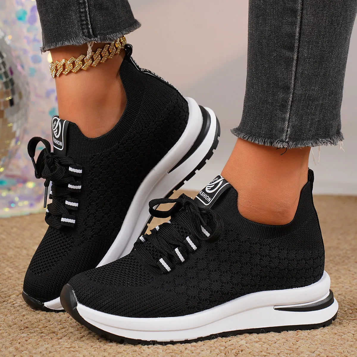 Women's black mesh lace-up sneakers with flat rubber sole and round toe