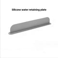 Grey blue silicone sink water blocking plate measuring 52mm by 85mm on a kitchen counter.