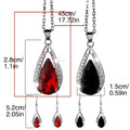 Teardrop pendant necklace and matching earrings jewellery suite in alloy with black or red glass accents