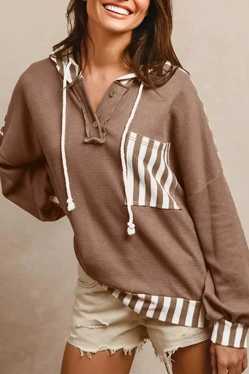Straw yellow hoodie with waffle texture striped patchwork and a button neck drawstring