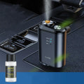 Black car aromatherapy smart fragrance diffuser with ocean scent bottle next to it