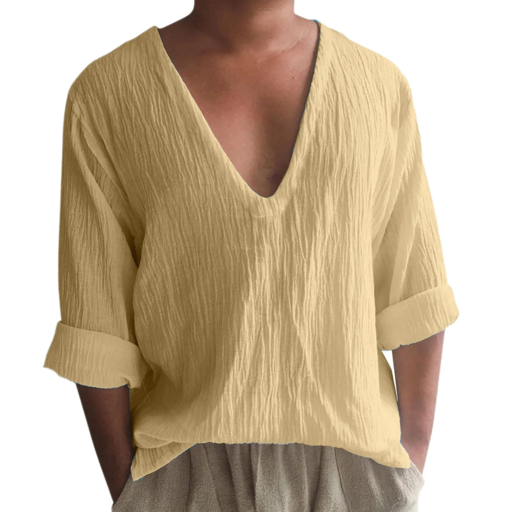 Man modelling a long sleeve V-neck T-shirt in washed cotton, available in multiple solid colours.