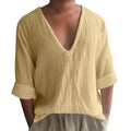 Man modelling a long sleeve V-neck T-shirt in washed cotton, available in multiple solid colours.
