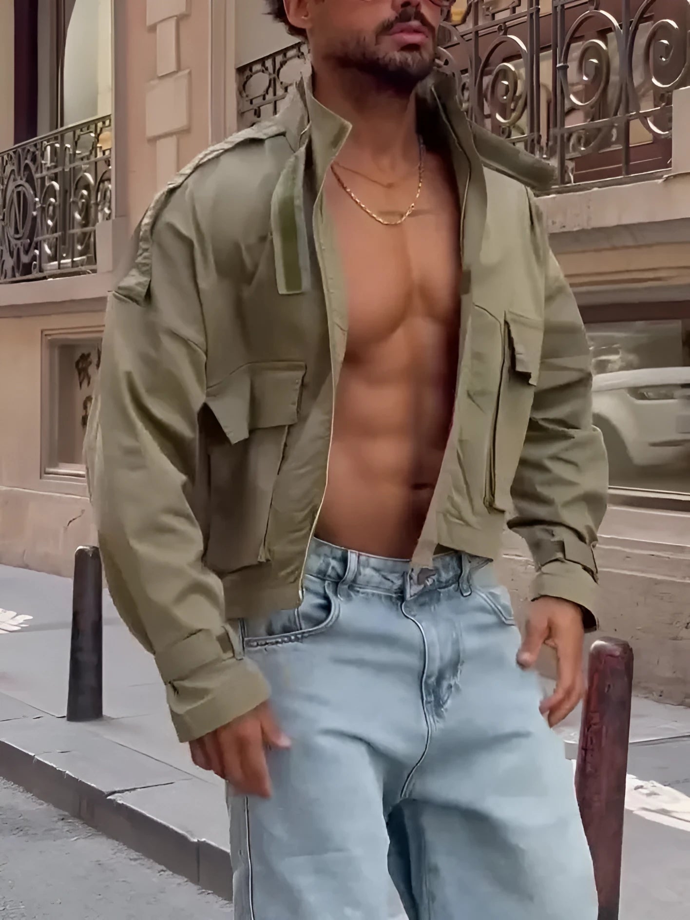 Cropped utility jacket in olive green with cargo pockets and patchwork design on a model