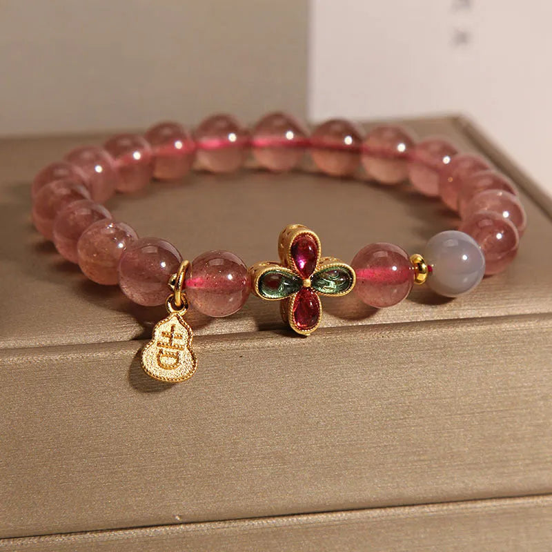 Natural strawberry quartz bracelet for women with four-leaf clover and calabash pendant on alloy chain with rhinestone accents
