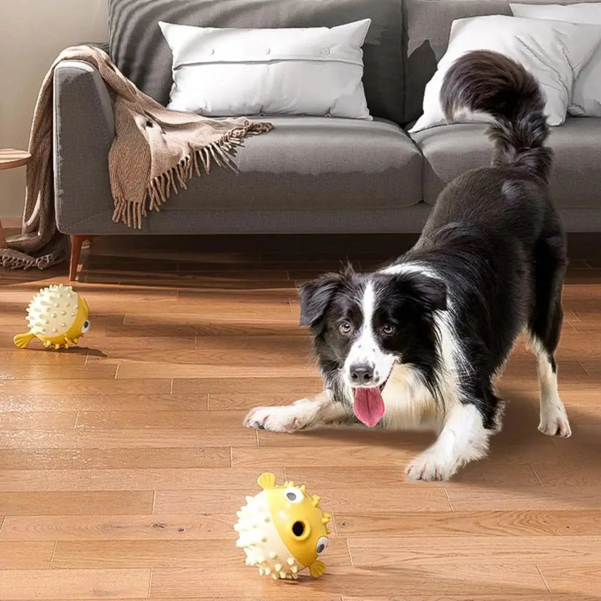 Yellow vinyl fish-shaped dog chew toy with textured surface for teeth cleaning.