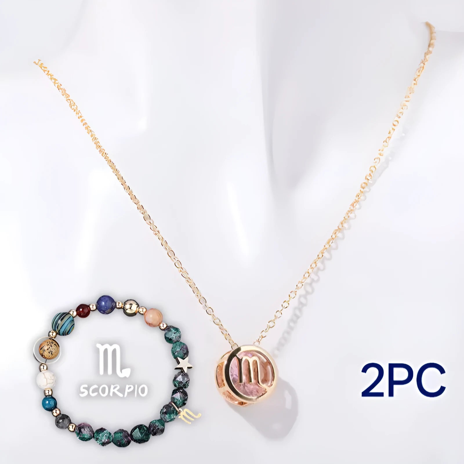 Natural stone beaded necklace and matching bracelet set laid flat showing polished gemstone beads and metal clasp.