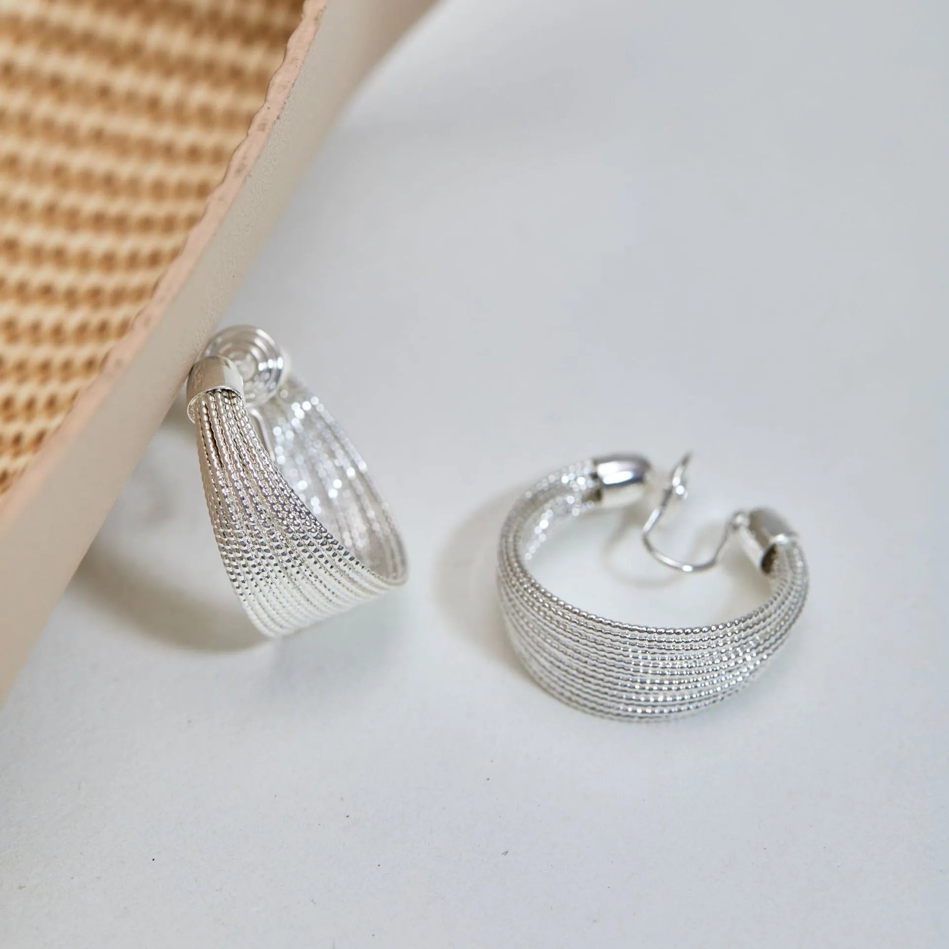 Geometric layered bracelet earrings with matching stud and clip earrings in gold or silver finishes