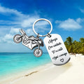 Stainless steel motorcycle keychain with velvet cloth on flannel background