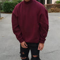 Solid colour men's round neck sweater in wine red, long sleeves, loose fit, plain knit polyester top