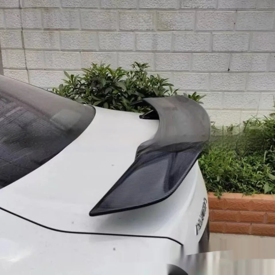 Universal punch-free car tail wing spoiler in ABS plastic, shown in a choice of finishes.