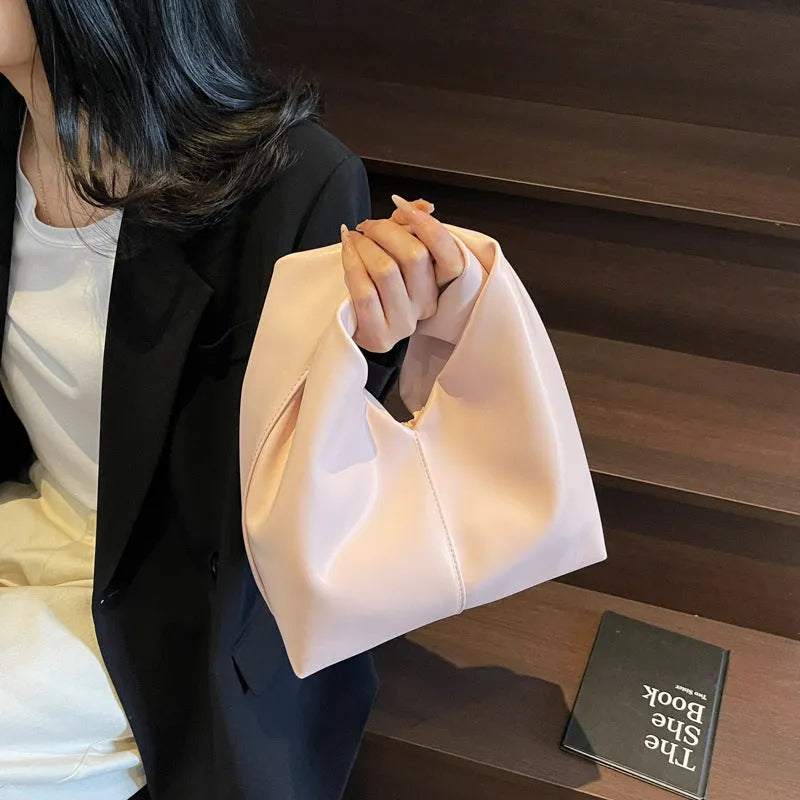 Women's casual PU leather foldable dumpling handbag in multiple colours showing sandwich pocket.