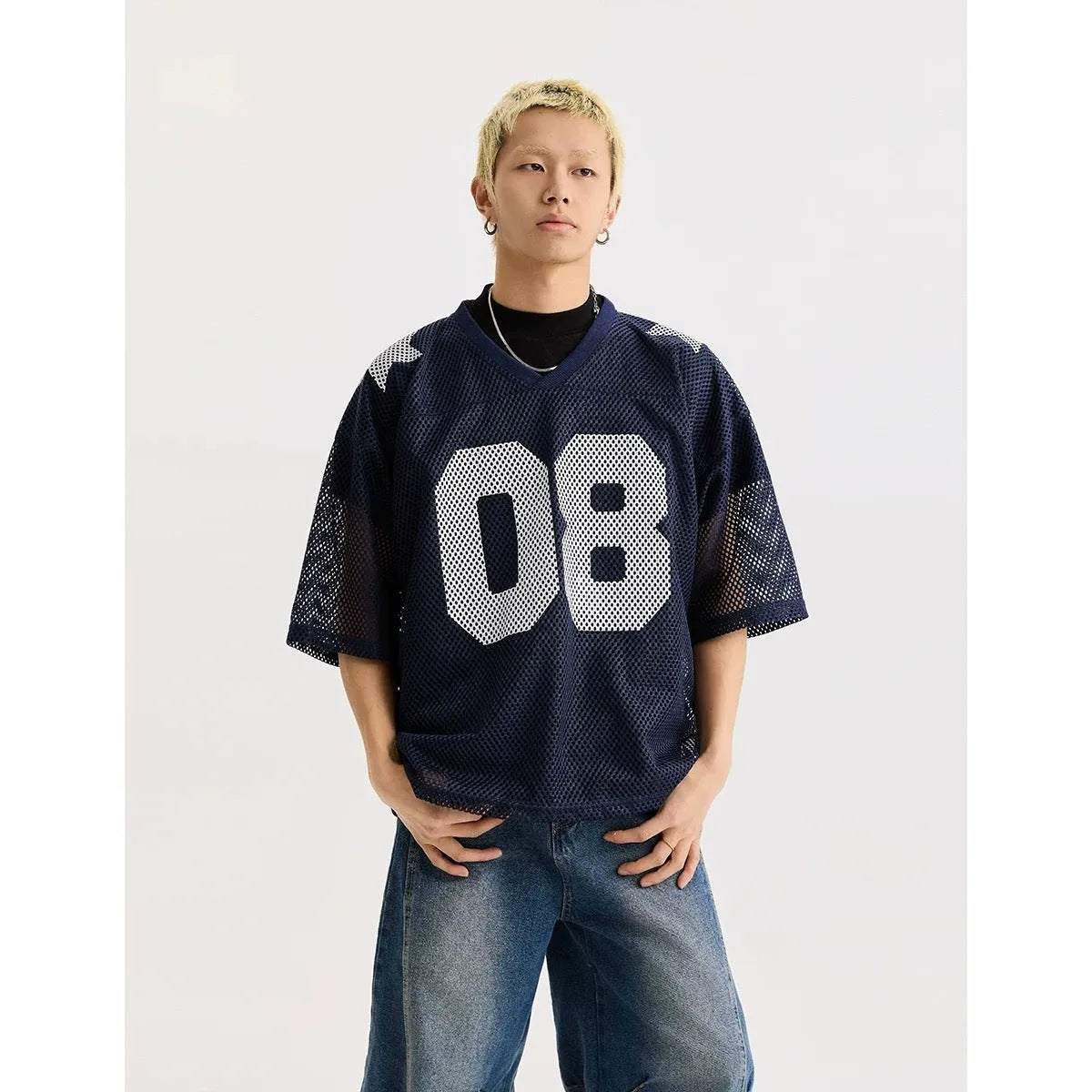 Black loose fit pullover top with white letter pattern and short sleeves