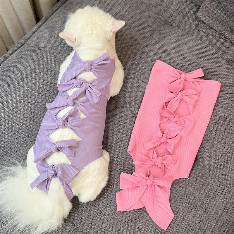 Lace-up polyester cat sterilisation clothing shown in blue on a mannequin, sizes for cats 1.5kg to 9kg.