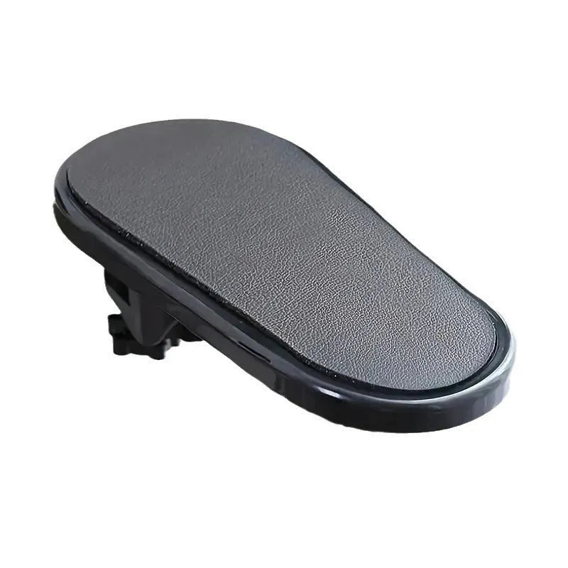 Black plastic computer hand bracket wrist support with modern simplicity style on a white desk surface