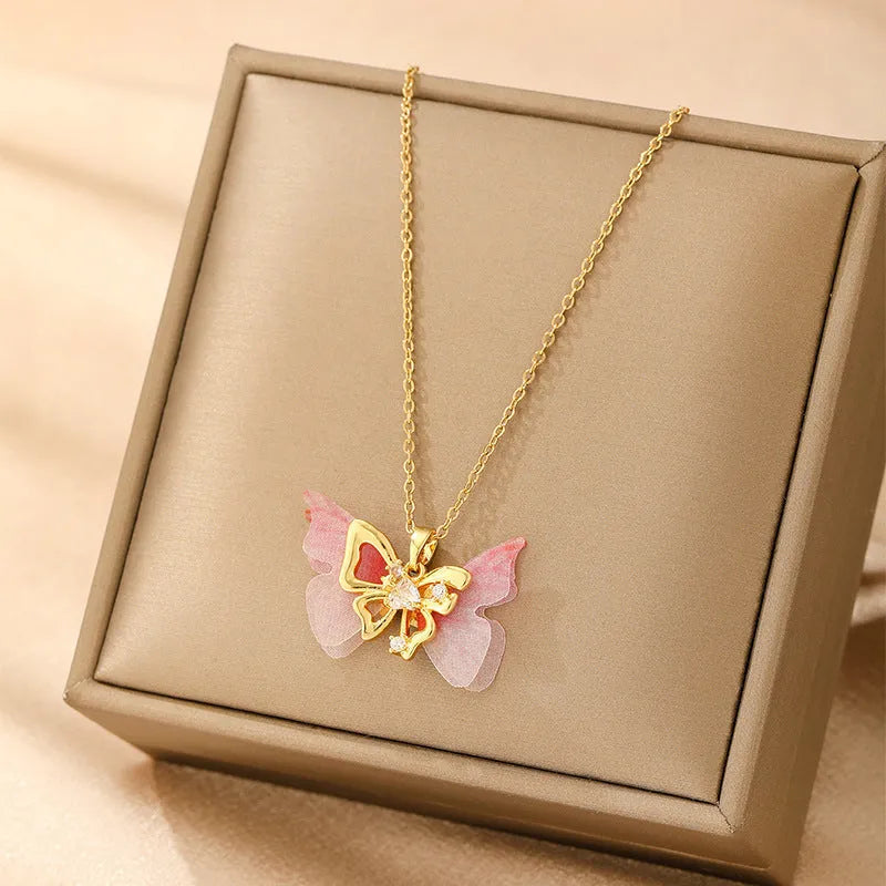 Women's copper necklace showing a choice of butterfly, cross, heart, and round diamond electroplated pendants.