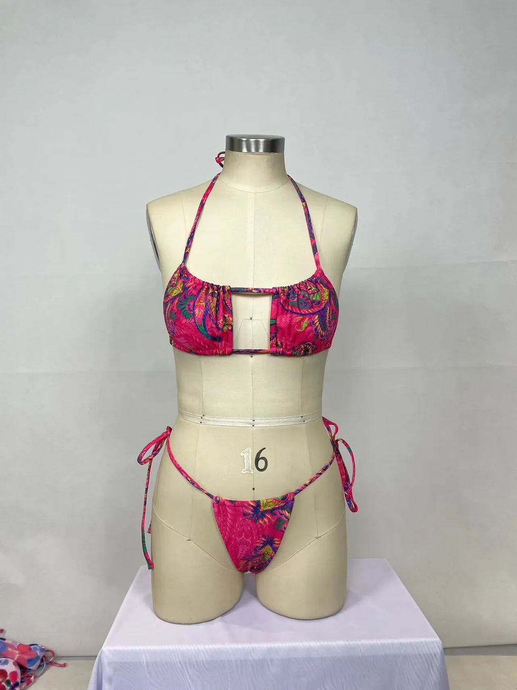 Women's pink printed nylon bikini two-piece set showing front and back views