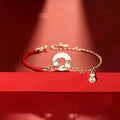 Festive koi bracelet with red rope adjustable closure and peace buckle on mixed materials