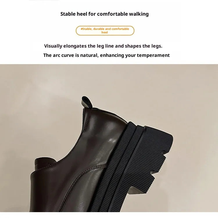 Women's black chunky heel British style shoes with square heel, cross strap, and round toe
