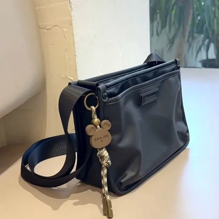Small square crossbody bag in trendy cool colour made from Oxford cloth with street trend styling