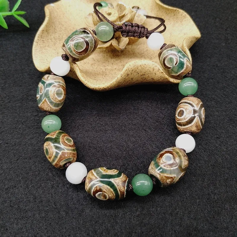 Green agate Tibetan bracelet with three-eye geometric bead pattern and adjustable cord closure