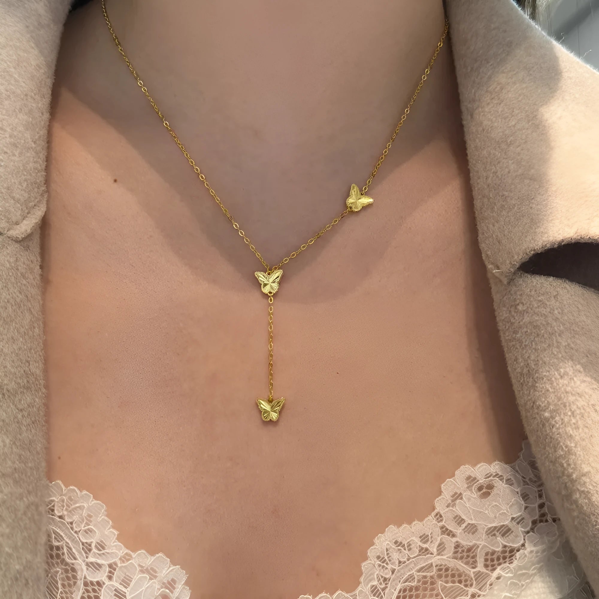 925 silver tassel butterfly pendant clavicle chain in electroplated 14K gold colour on display