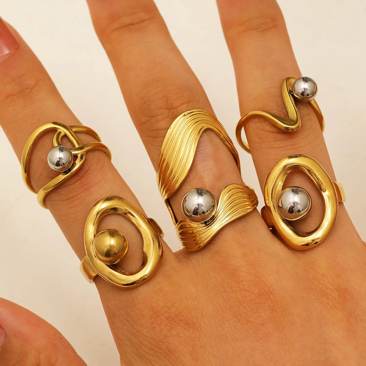 Geometric hollow line open ring in 304 stainless steel with 18K real gold finish, ellipse design