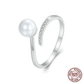 S925 sterling silver adjustable ring with shell pearls on woman's hand
