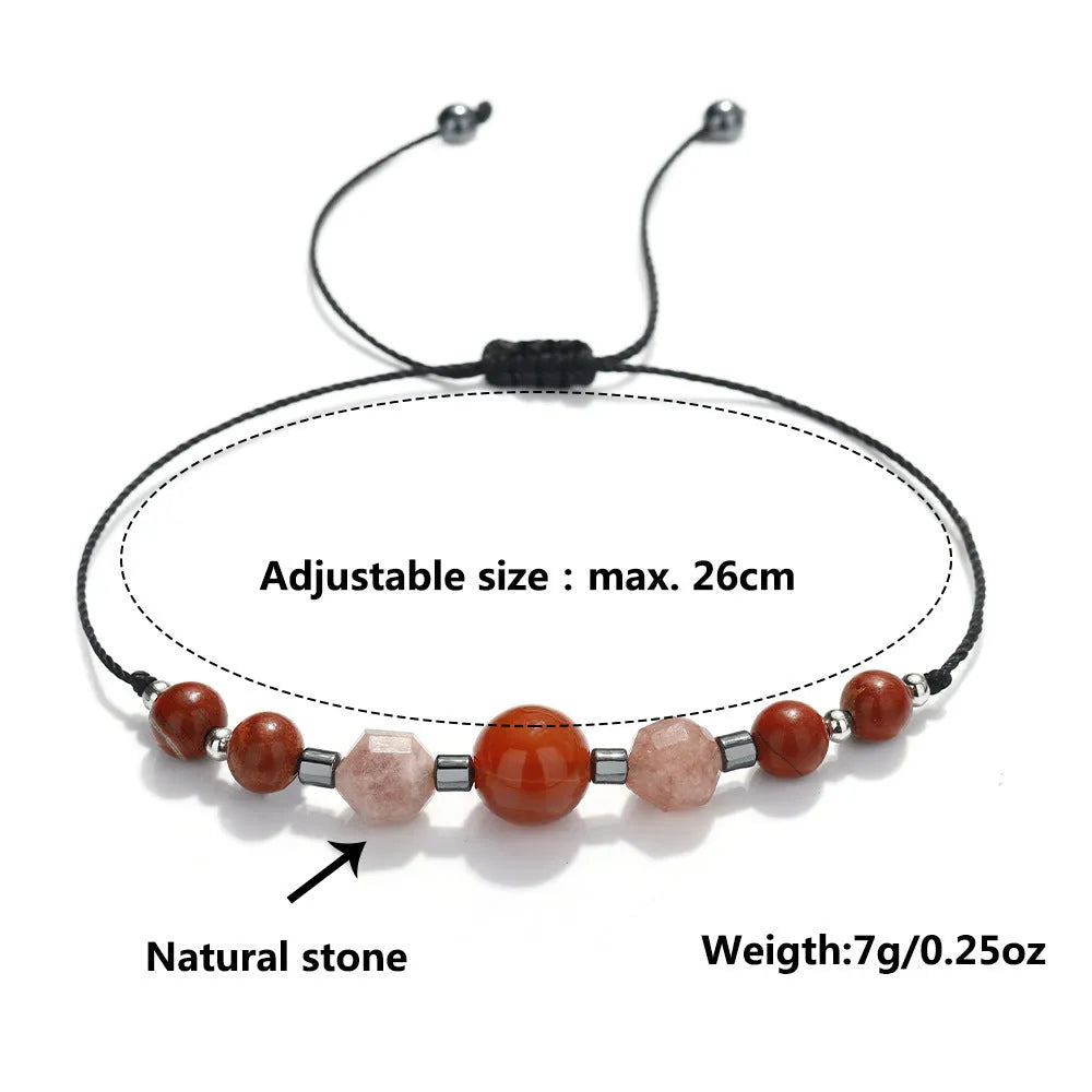 Handmade red crystal bracelet with sunstone, redstone and copper beads in a geometric design.