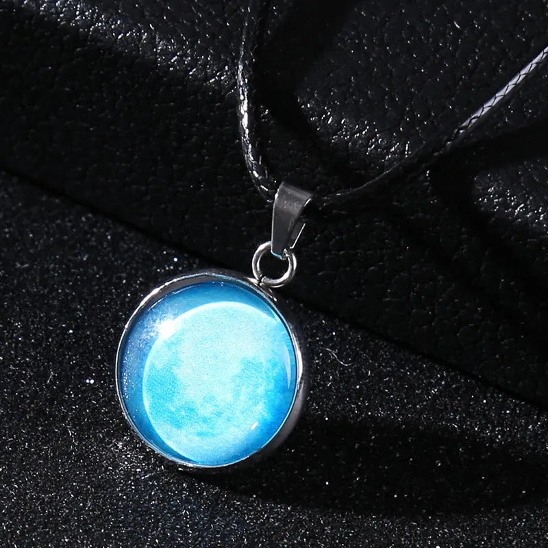 Luminous alloy necklace with a constellation-modelled glass pendant on an adjustable chain.