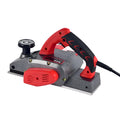 Red aluminium electric wood planer with 82mm width on workbench