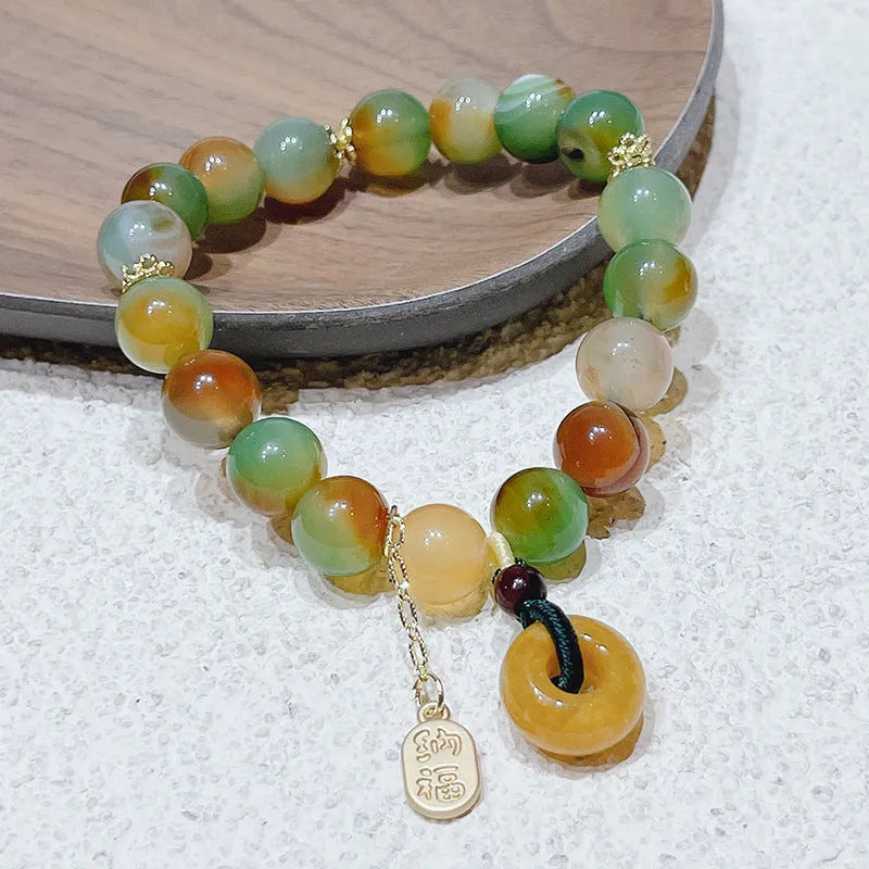 Yellow peacock agate bracelet with peace buckle clasp and old mine topaz stones