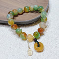 Yellow peacock agate bracelet with peace buckle clasp and old mine topaz stones