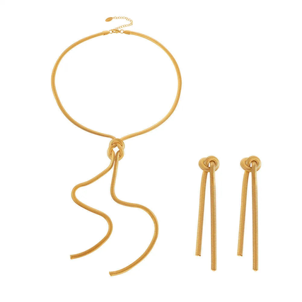 Gold electroplated titanium steel necklace with knotted tassel pendant on snake chain and matching earrings