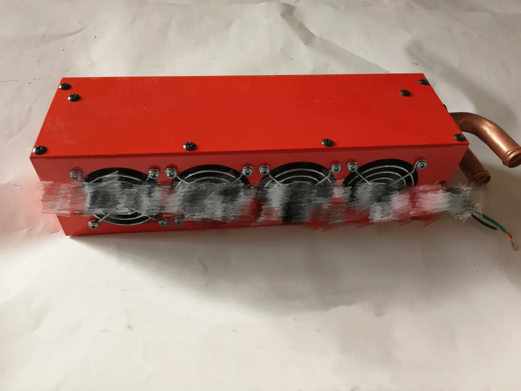 Compact metal car heater with copper pipe connections for 12V and 24V vehicle auxiliary heating