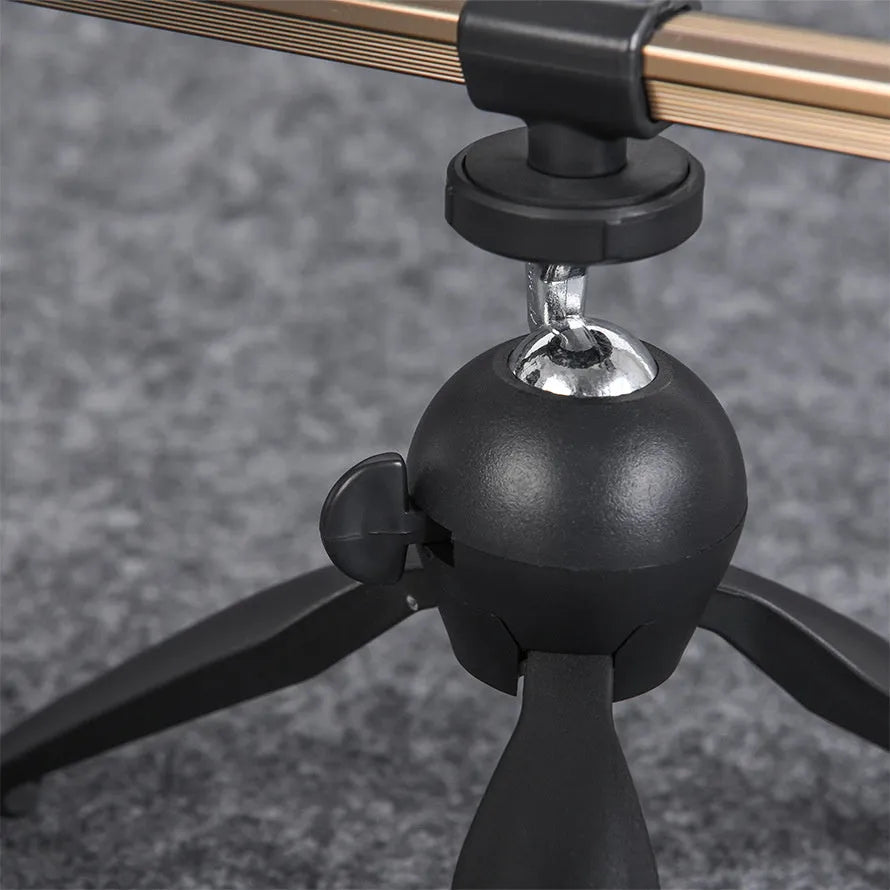 Aluminium tripod ice fishing rod holder bracket on ice.