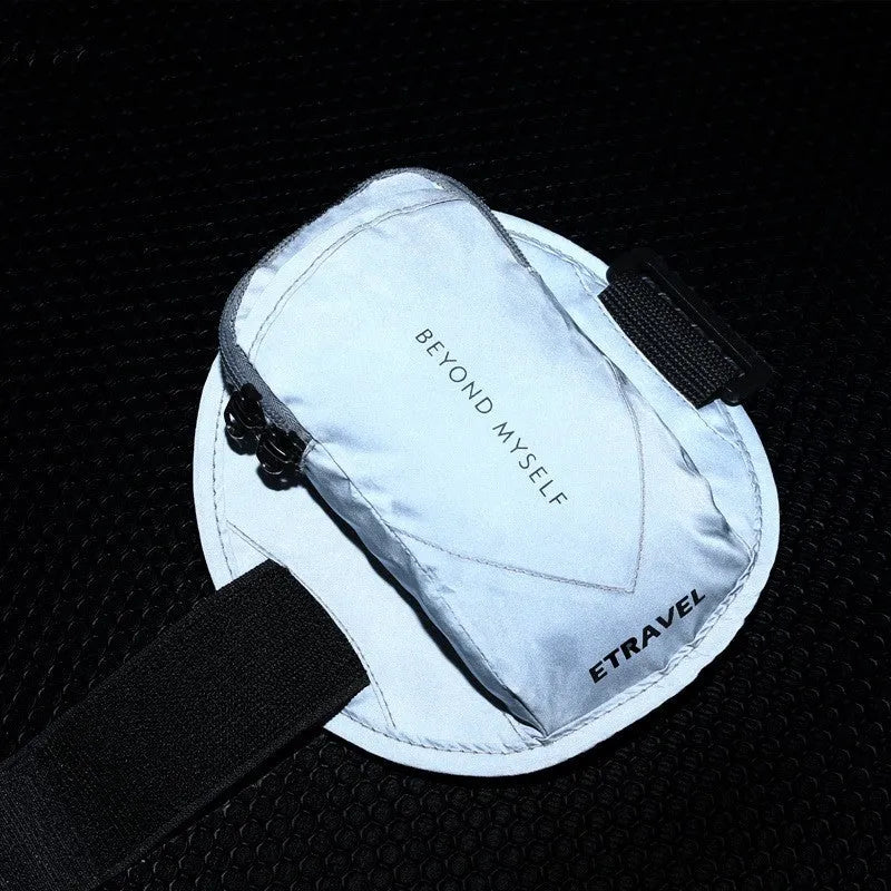 Lightweight reflective running arm bag in black, yellow, or grey, shown on an arm.