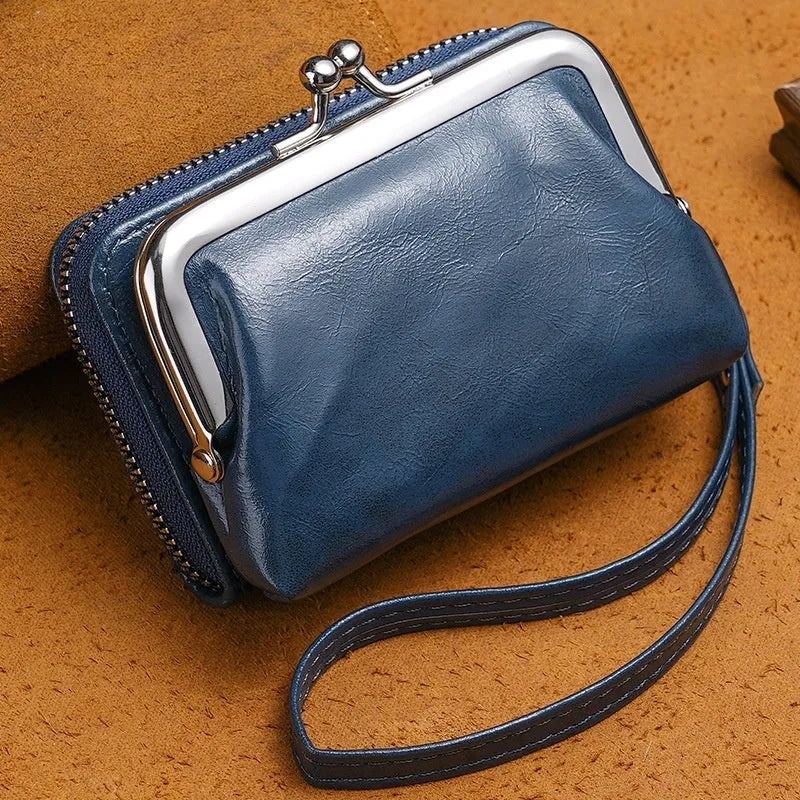 Ladies' 4-inch leather alternative coin purse with a metal clip buckle, shown in jujube red.