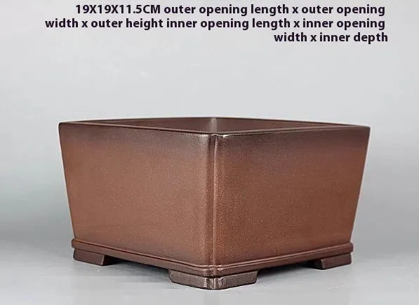 Brown handmade purple clay flower pot with antique finish.