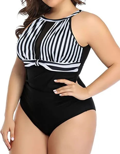 Women's black lace one-piece swimsuit on a hanger showing the front design